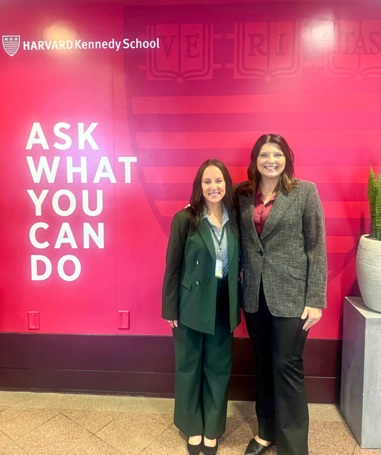 Carleen Maurer Krista Woodgrift pose at Harvard Conference